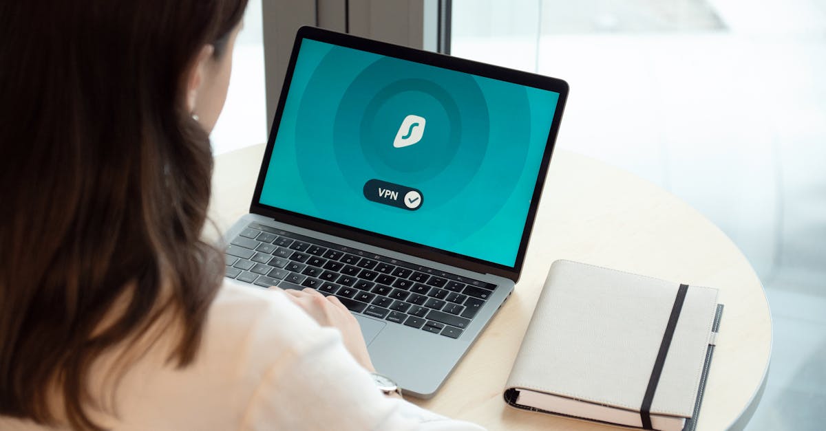 A woman working on a laptop with a VPN icon on screen for secure online browsing.
