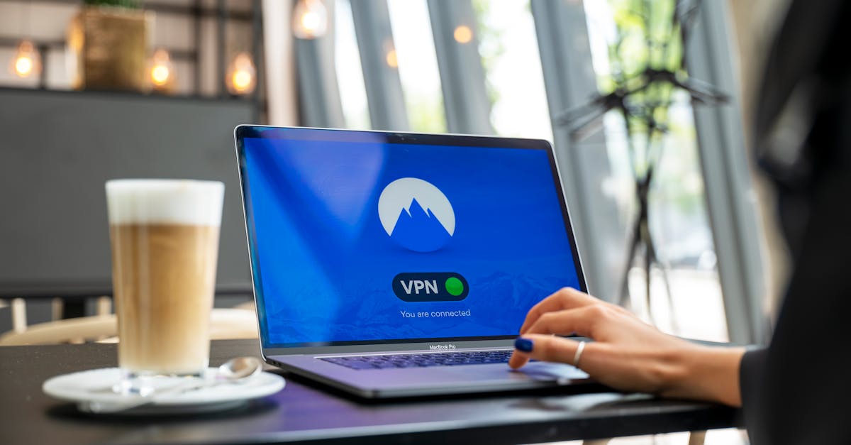A person using a laptop with a VPN connection in a modern cafe setting, showcasing remote work and internet security.